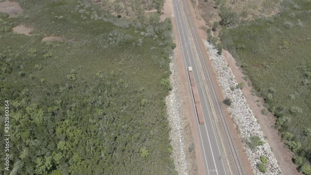 directly above drone shot of truck driving on a road in Northern Territory, Outback Australia directly above drone shot of truck driving on a road in Northern Territory, Outback Australia