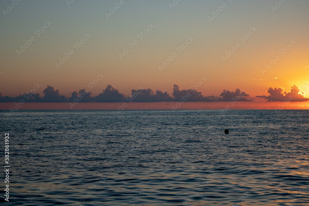 Beautiful sunset over the sea overlooking the clouds and the horizon. Beautiful sunset over the sea overlooking the clouds and the horizon.