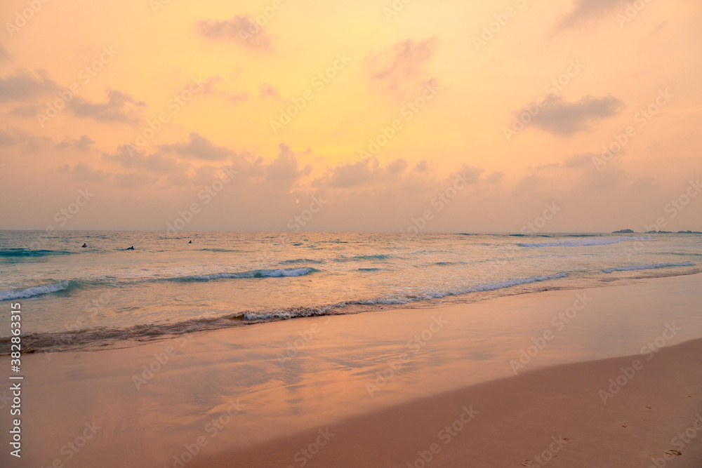 Ocean with sunset sky and sun through the clouds over. Meditation ocean and sky background. Tranquil seascape. Horizon over the water.
