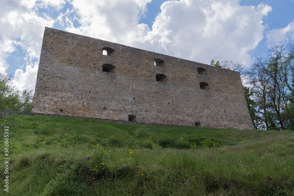 Ancient Chigirin castle, fortress on a green hill on a blue sky with clouds background, Ukraine