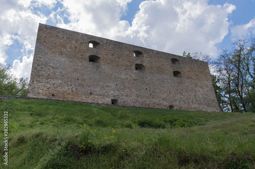 Ancient Chigirin castle, fortress on a green hill on a blue sky with clouds background, Ukraine