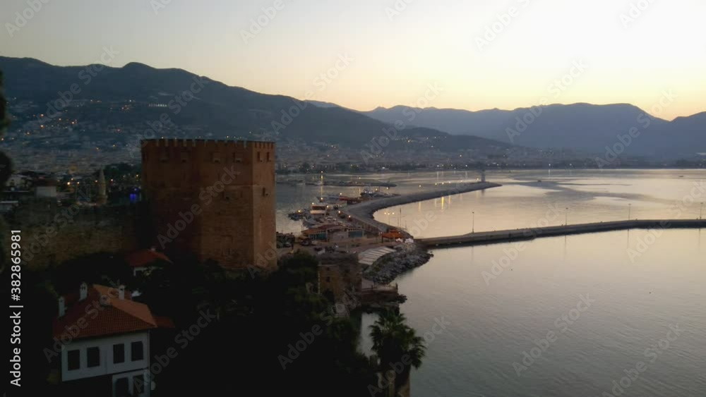 Alania.Turkey.September 4, 2020.View of the walls of the ancient fortress and the tower of Kyzyl Kule in Alanya in Turkey at sunset Alania.Turkey.September 4, 2020.View of the walls of the ancient fortress and the tower of Kyzyl Kule in Alanya in Turkey at sunset