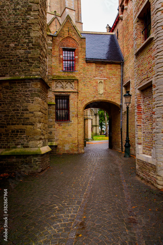 Fototapeta Naklejka Na Ścianę i Meble -  Bruges, Flanders, Belgium, Europe - October 1, 2019. Medieval ancient houses made of old bricks on ancient medieval street in Bruges (Brugge)