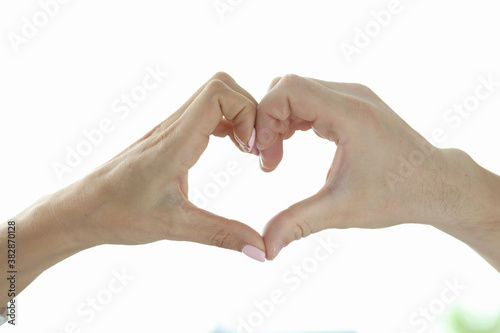 Heart sign made from hands. Male and female hand together depicts heart. Charity concept.