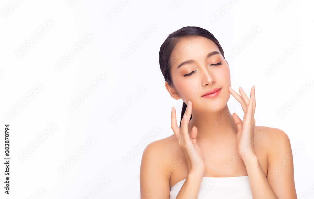 Beautiful young asian woman with clean fresh skin, closed eyes. Female beauty face care. bear shoulder. Glamour girl touching her beauty face. Facial treatment, cosmetology and beauty skin concept Beautiful young asian woman with clean fresh skin, closed eyes. Female beauty face care. bear shoulder. Glamour girl touching her beauty face. Facial treatment, cosmetology and beauty skin concept