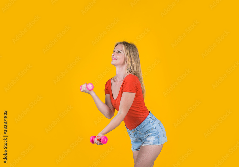Woman wiyh dumbbells. Exercise for arms. Woman working out with dumbbells. Fitness woman holding dumbbell. Strength and motivation. Woman wiyh dumbbells. Exercise for arms. Woman working out with dumbbells. Fitness woman holding dumbbell. Strength and motivation.