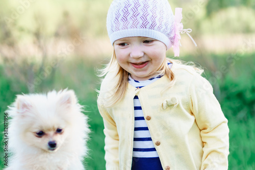 little girl with a dog. emotion of joy and irrepressible fun
