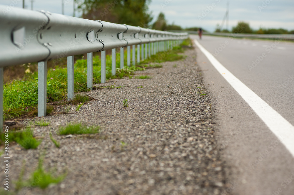 Smooth asphalt road with bumpers and markings Smooth asphalt road with bumpers and markings
