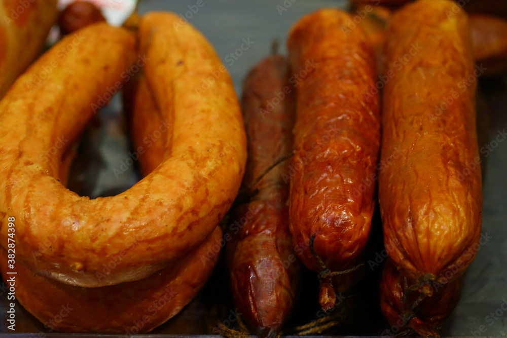 Sausage on the counter. Cooked-smoked sausage delicacies Sausage on the counter. Cooked-smoked sausage delicacies