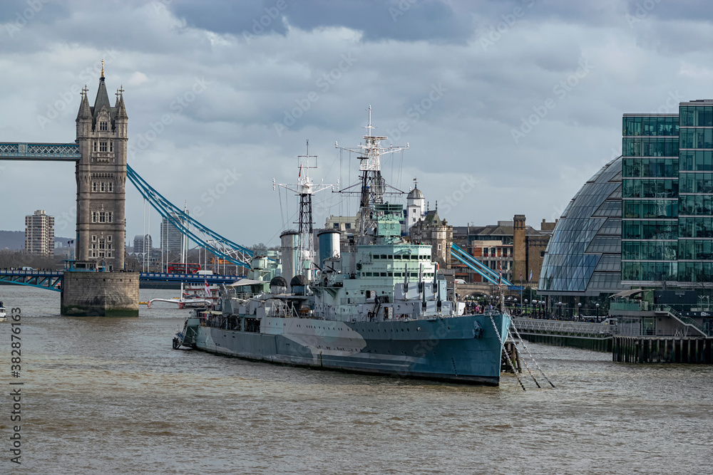 Mythical warship on the river Thames of the light cruiser type, named HMS Belfast. Photograph taken in London, England, United Kingdom.