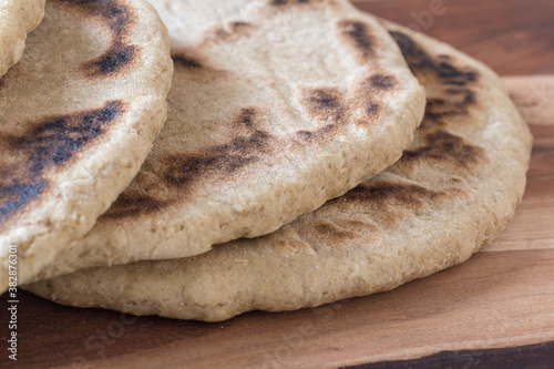 arabic barley flat bread, Flatbread homemade and fresh from the oven, Moroccan Pita Bread (Batbout), berber bread (toghrift ntomzine) photo