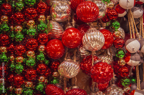 Christmas background of decorative balls including mercry ornaments in grreen and red and silver © Susan Vineyard 