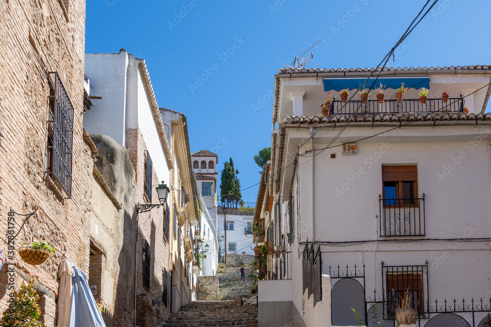 Cuesta de Abarqueros, typical narrow pedestrian street with steps in the Albaicín neighborhood in Granada