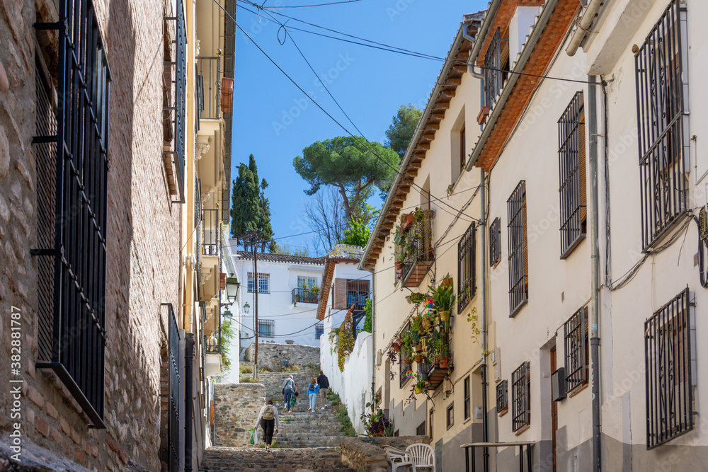 Cuesta de Abarqueros, typical narrow pedestrian street with steps in the Albaicín neighborhood in Granada