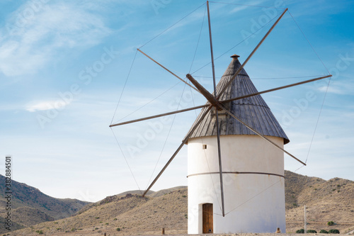 white windmill in the spain desert