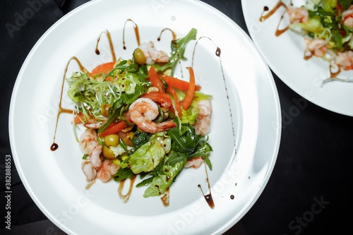 Green salad with shrimps. Healthy seafood meal