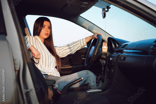 car, woman, driving, driver, young, happy, auto, vehicle, beautiful, automobile, sitting, smiling, person, people, drive, beauty, transportation, businesswoman, lady, business, travel, transport, smil