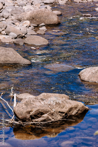 Close-up of rocks in Kauaeranga River in New Zealand photo