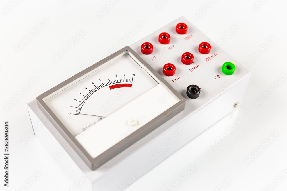 an analog multimeter - voltmeter and ammeter isolated on a white background an analog multimeter - voltmeter and ammeter isolated on a white background