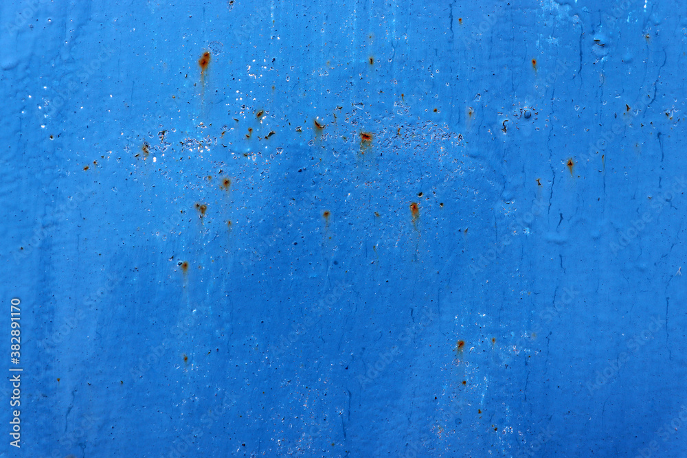 Blue cracked and scratched paint surface Blue cracked and scratched paint surface
