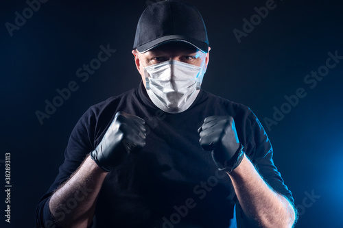 A man in a mask and rubber ...