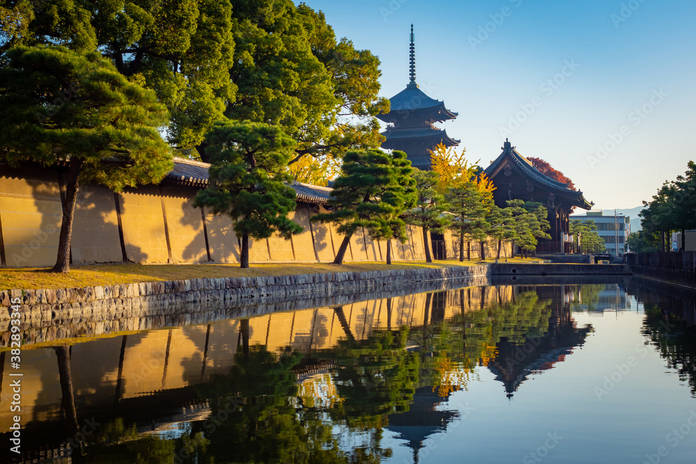 Japan. Pond at Higashi-Honganji temple. Big brown Buddhist temple in Kyoto. Temples Of Japan. Shinto the Church of no people close-up. Iconic buildings in Kyoto. Travelling to Japan. Japan. Pond at Higashi-Honganji temple. Big brown Buddhist temple in Kyoto. Temples Of Japan. Shinto the Church of no people close-up. Iconic buildings in Kyoto. Travelling to Japan.
