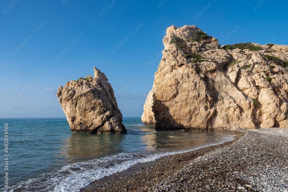 Cyprus. View from the pebble beach to the Aphrodite stone. The birthplace of Aphrodite. Cyprus Tourist Attraction. Mediterranean coast. Kuklia. Petra tou Romiou. Pathos. Holidays in Cyprus.