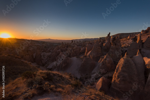 Rock Formations landscape of Goreme National Park at sunset, Cappadocia, Turkey. © sola_sola
