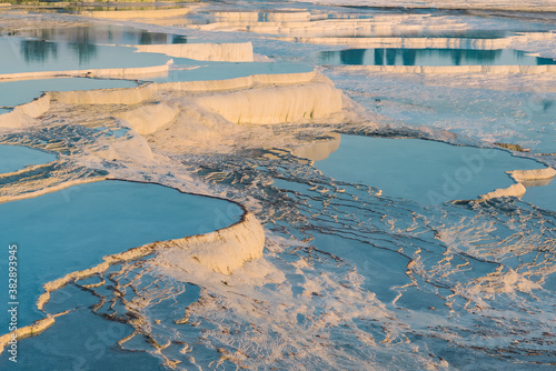 Natural travertine pools and terraces at sunset in Pamukkale  Turkey