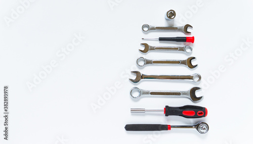 Christmas tree made of construction tools on a white background. New Year Concept for auto workshop