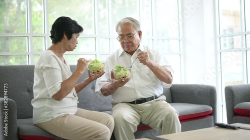 An elderly couple are eating healthy food , grandparents health care concept .