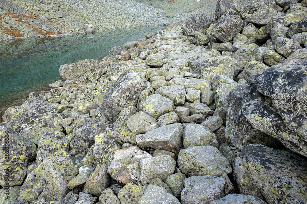 Pond in Valley of Five Spis Lakes surrounded by rocky summits, High Tatra Mountains. Slovakia Pond in Valley of Five Spis Lakes surrounded by rocky summits, High Tatra Mountains. Slovakia