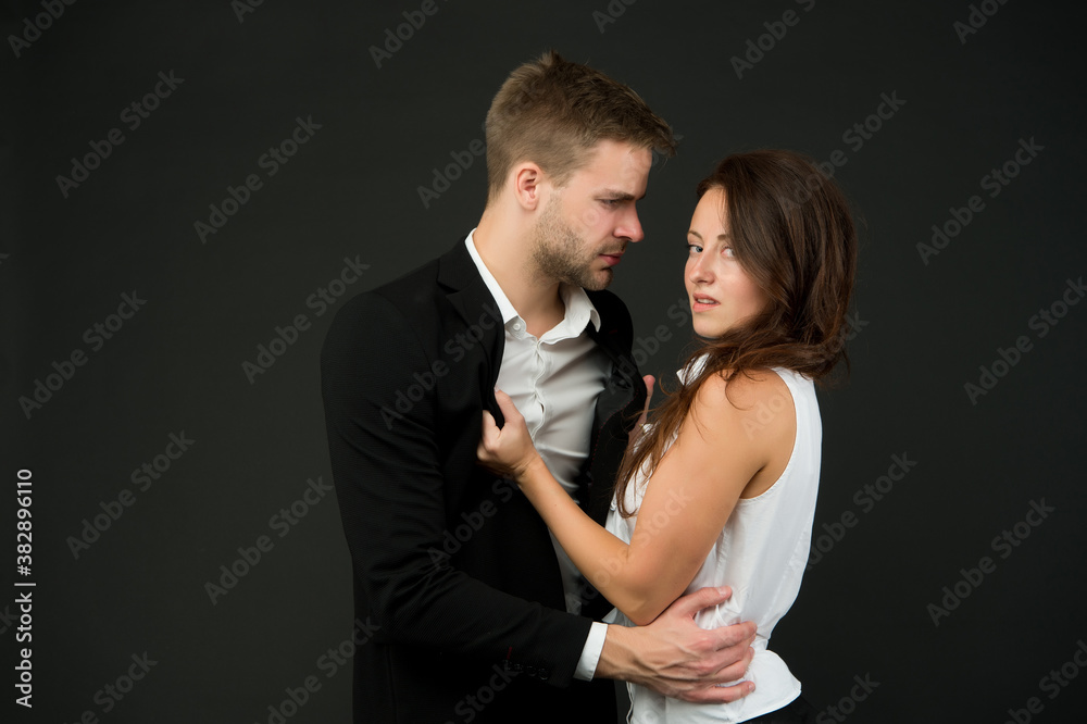 sexy couple in love. business couple represent sexual harassment. Office fashion and corporate attire. Desirable colleague. concept of partnership. man and woman embrace. love and romance sexy couple in love. business couple represent sexual harassment. Office fashion and corporate attire. Desirable colleague. concept of partnership. man and woman embrace. love and romance