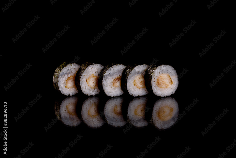 Fresh delicious beautiful sushi rolls on a dark background