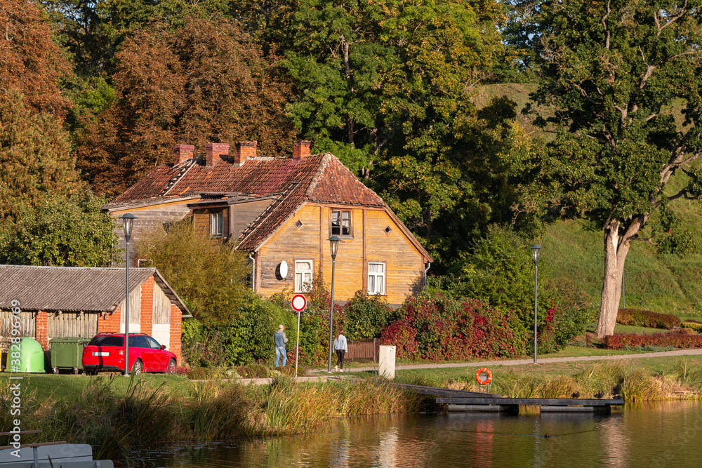 House by the lake in autumn. Beautiful nature view