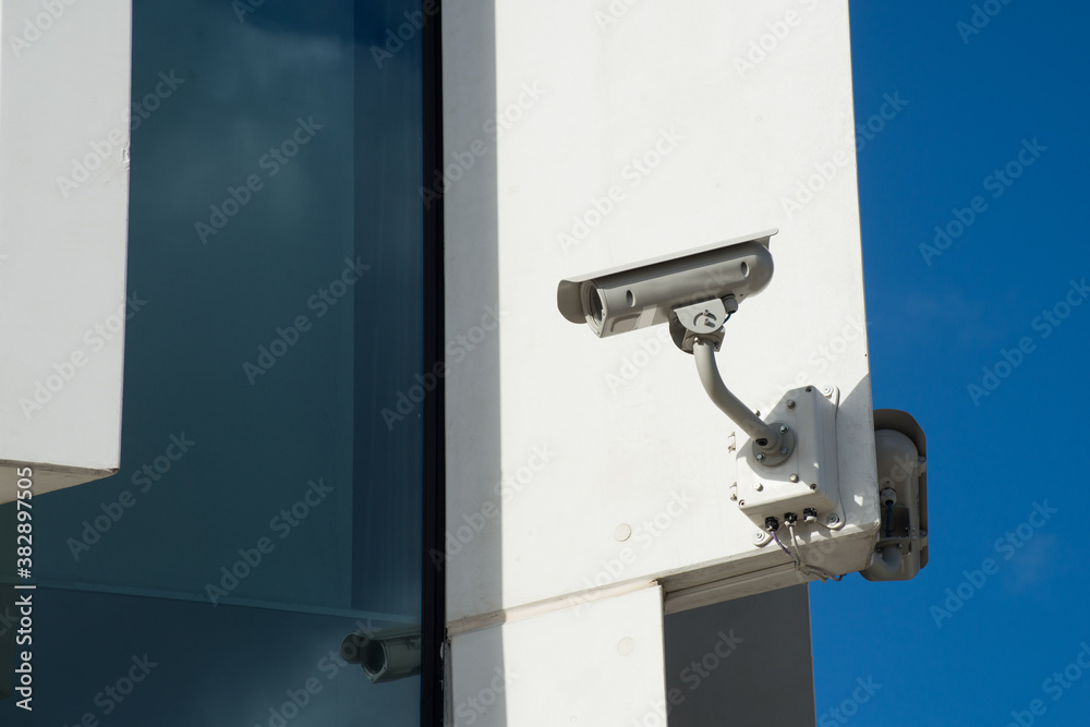 Closeup of security camera on modern building facade