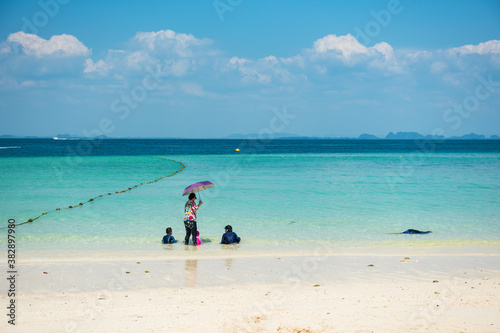 Family relax on beach at Poda islandin summer, Krabi