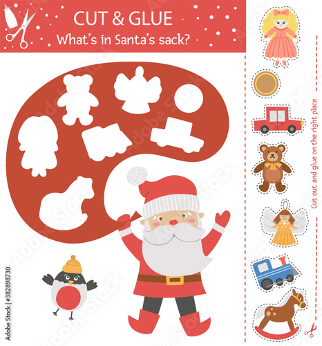 Vector Christmas cut and glue activity. Winter educational crafting game with cute Santa Claus, Bullfinch and toys. Fun activity for kids. What’s in Santa’s sack?.