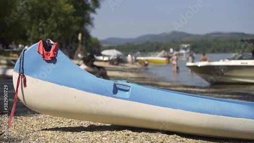 People bathe on the free beach on the bank of the Danube in summer, close to nature.