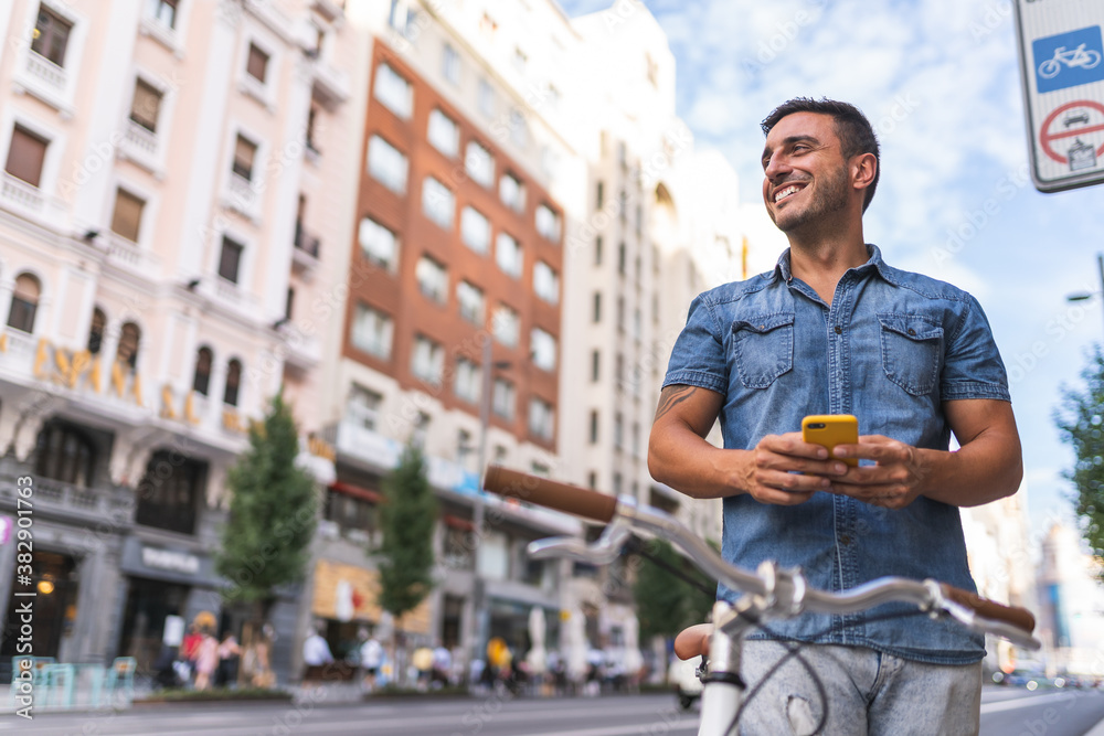 Latin American Young Man Using Phone Outdoors. Latin American Young Man Using Phone Outdoors.