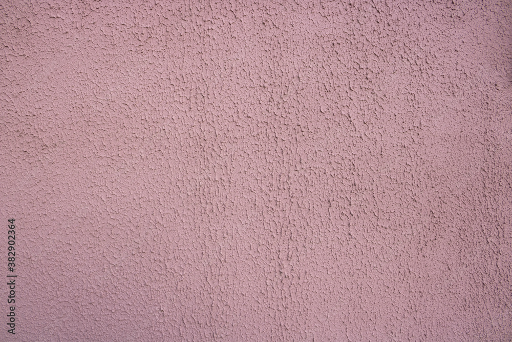 Fototapeta premium Pink decorative relief . Pink stucco wall. Pink background of the wall