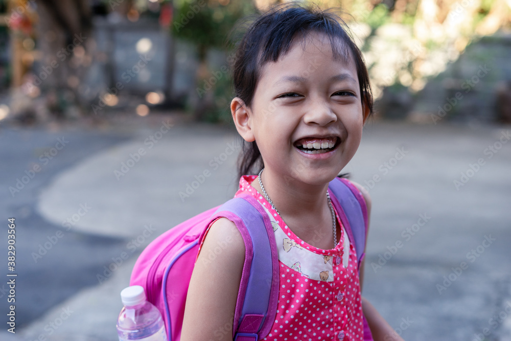 Happy smiling girl  going to school for the first time