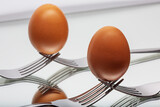 egg on forks in perfect balance