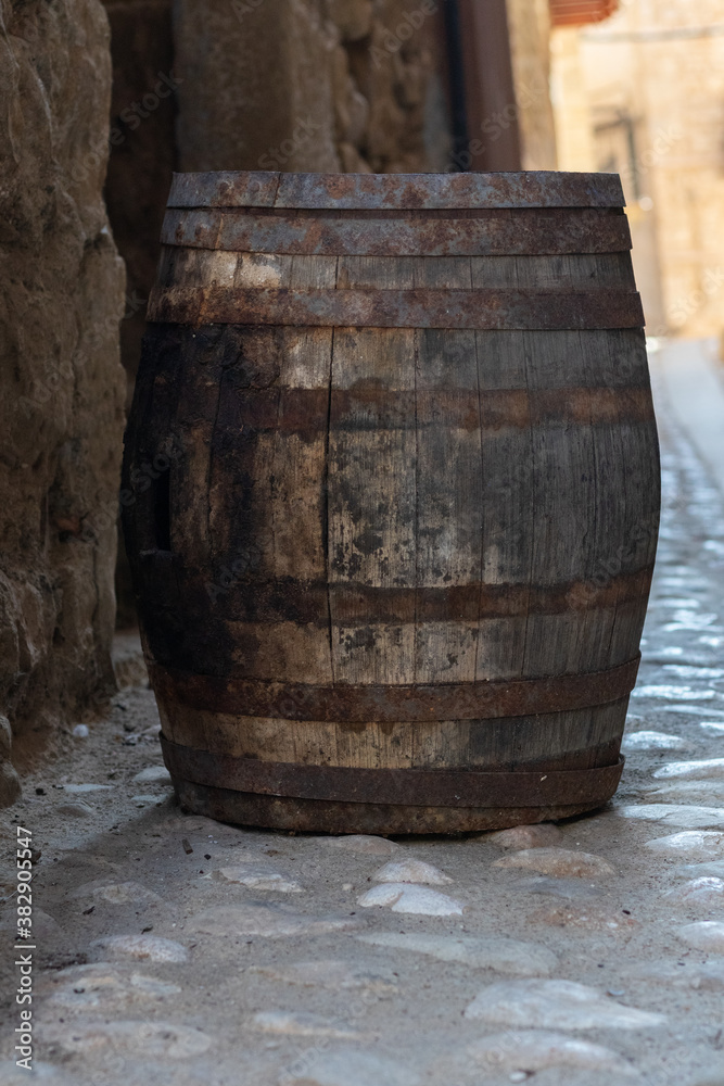 barrel of wine with wooden log in beautiful village barrel of wine with wooden log in beautiful village