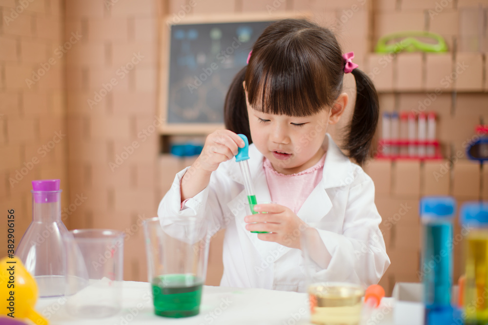 young  girl  play science experiments for homeschooling
