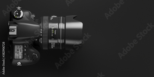 Professional digital photo camera on black background. Top view and space for text. photo