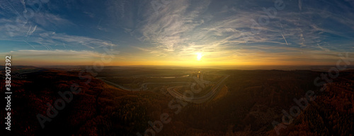 Landscape with the Automotodrom Racing circuit in Brno  Grand Prix of motorbikes and cars in the Czech republic. Panoramic view from the air during sunset
