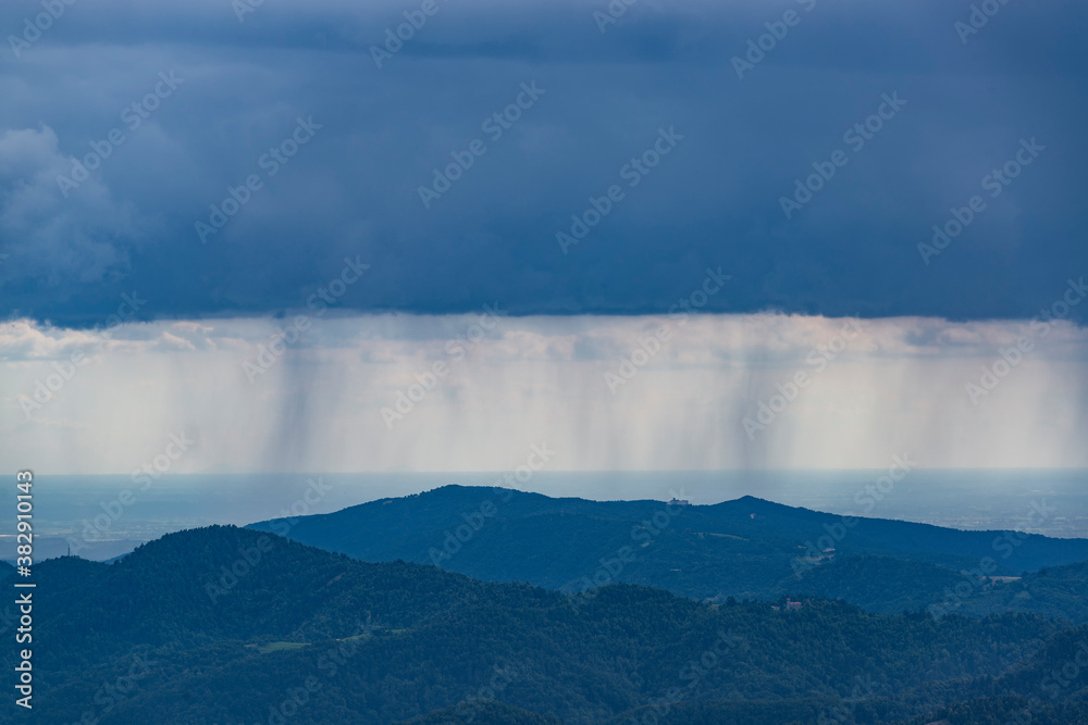 Rain in the Alps. Rain clouds over the mountain tops