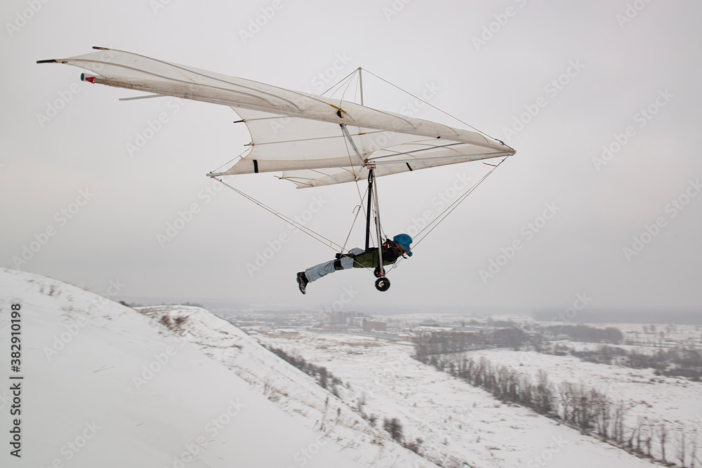 Student hang glider pilot on the training hill. Student hang glider pilot on the training hill.