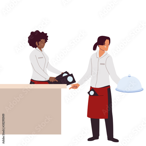 Waitress and waiter in uniform in restaurant